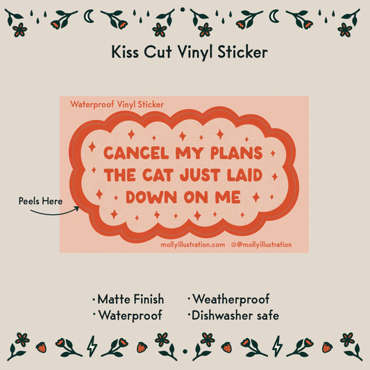 Vinyl sticker with text 'Cancel my plans the cat just laid down on me' on a beige background