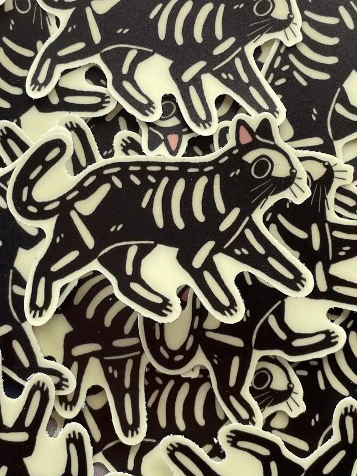 Pattern of black and white animal illustrations on a textured background