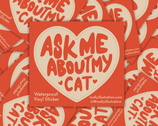 Red sticker with 'Ask me about my cat' text on a background of similar stickers