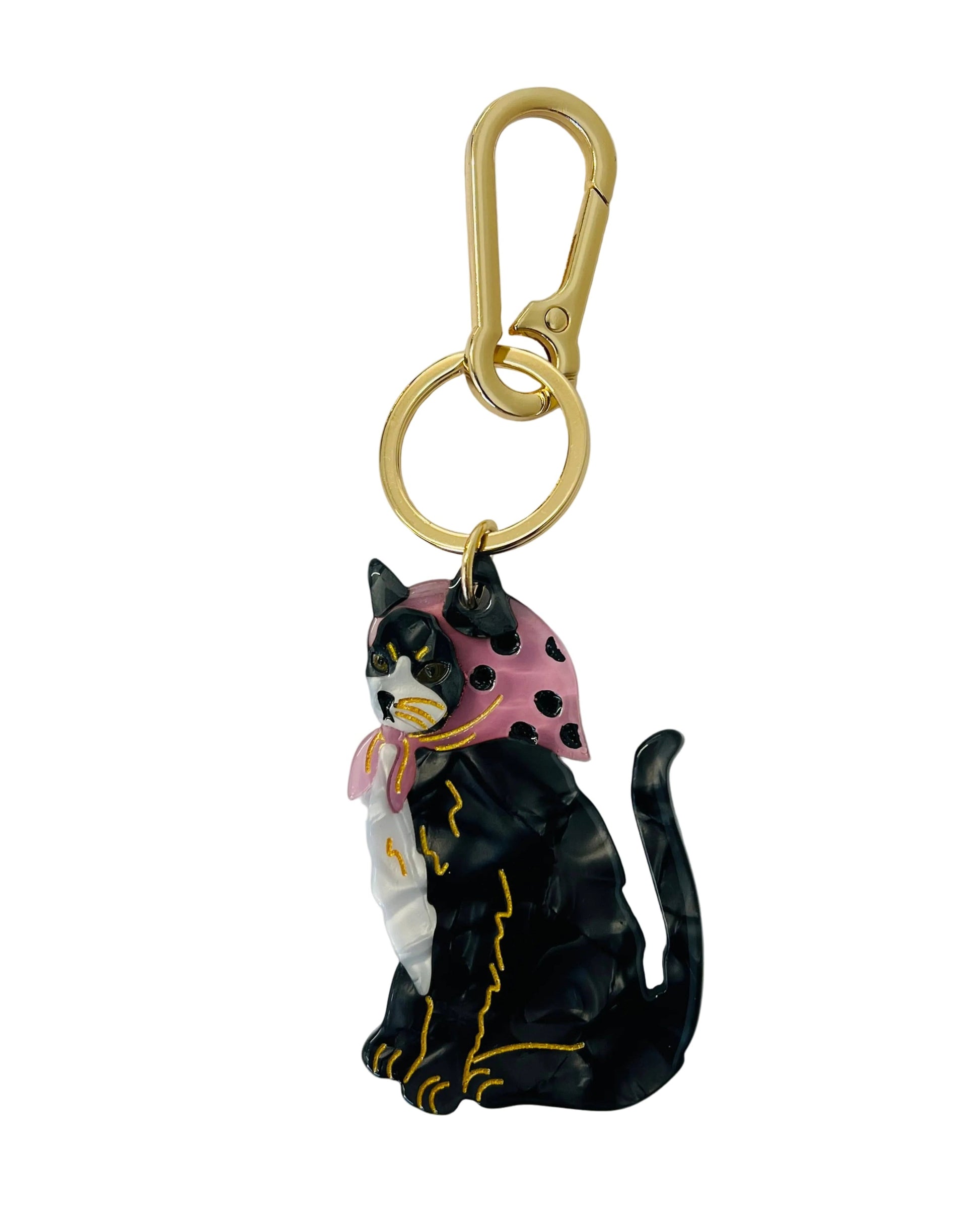 Black cat keychain with a pink bow on a white background