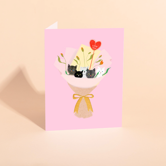 Greeting card with illustration of cats in a bouquet on a pink background