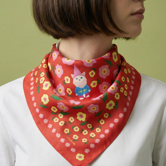 Person wearing a red floral scarf with a cartoon character on a green background