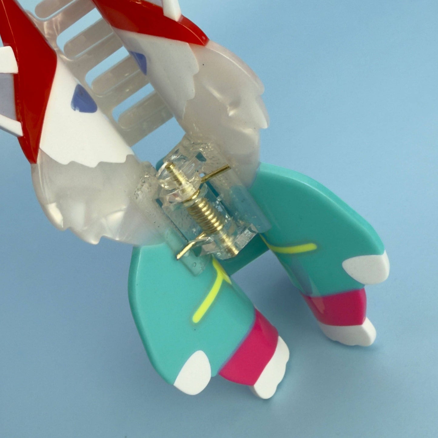 Colorful toy figure with a transparent torso on a light blue background