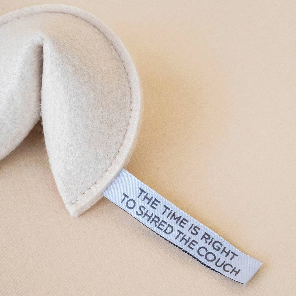 Textile product with a humorous label on a beige background