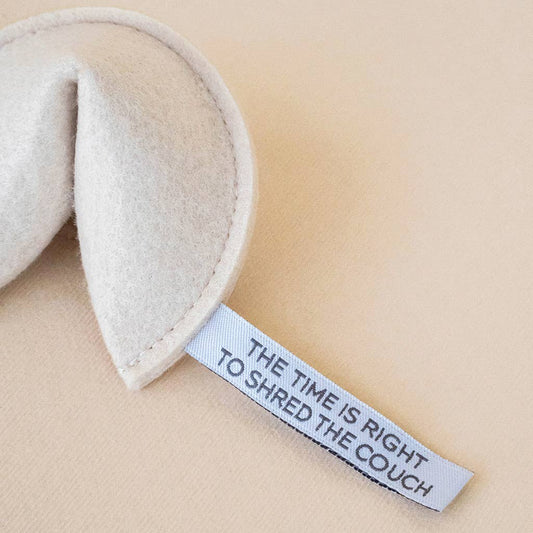 Textile product with a humorous label on a beige background