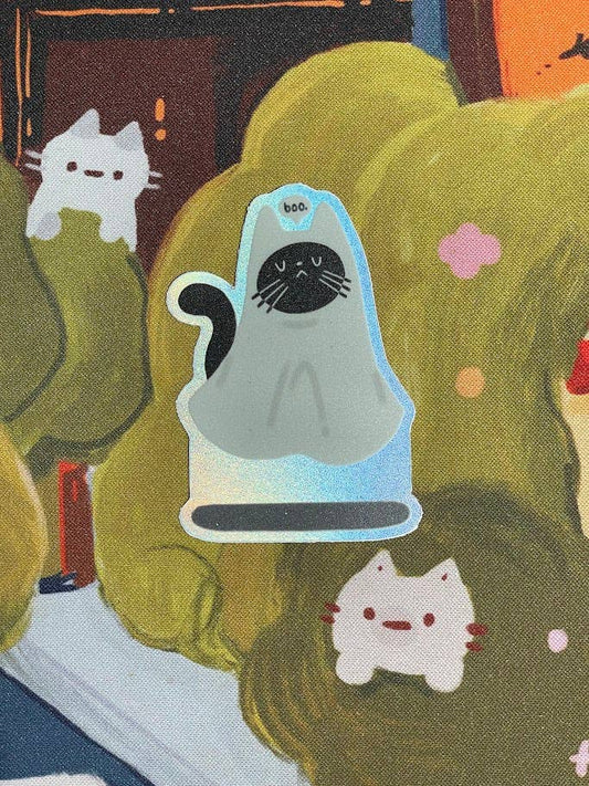 Illustration of a cat in a glass jar with two white cats on green fabric.