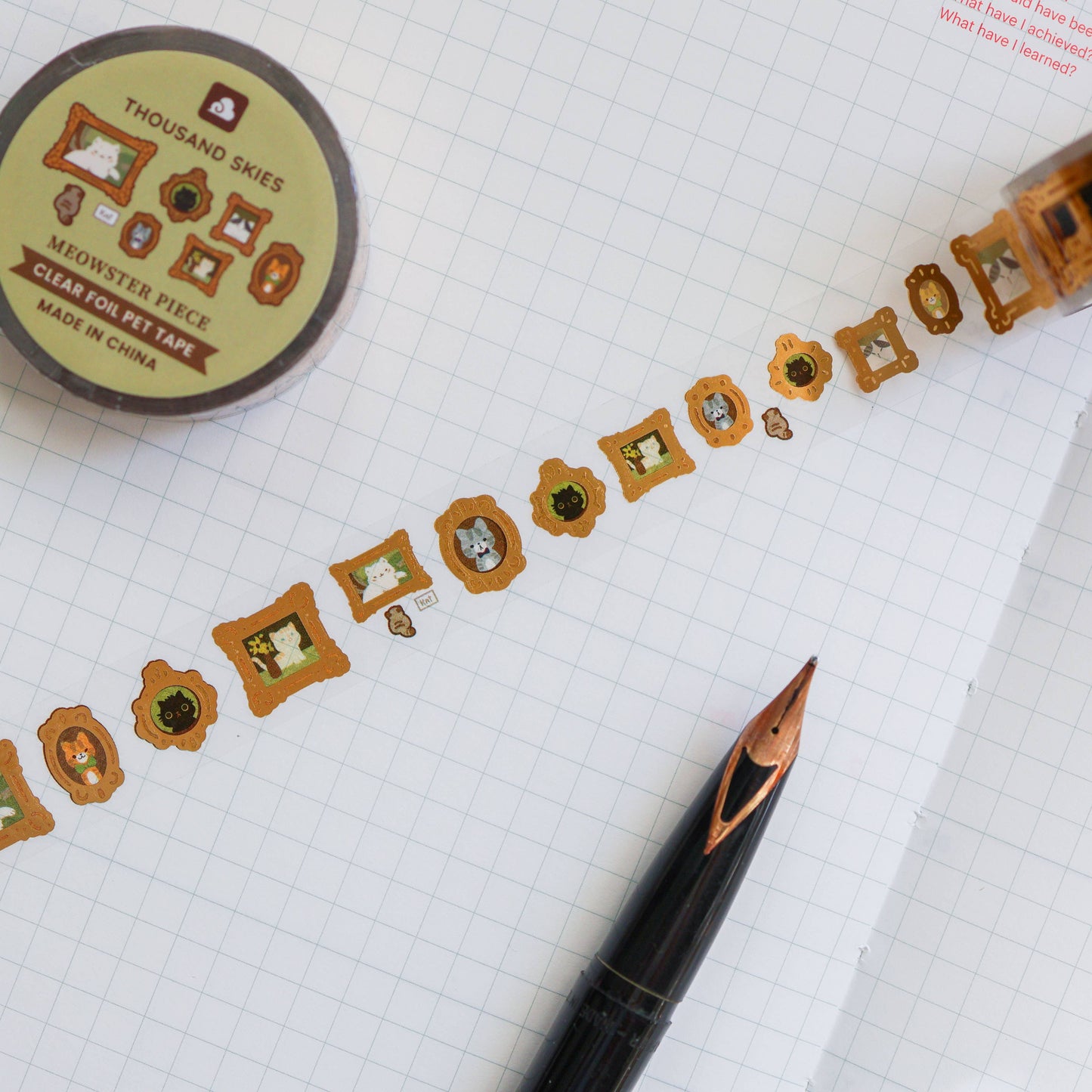 Decorative washi tape with decorative designs on a grid background