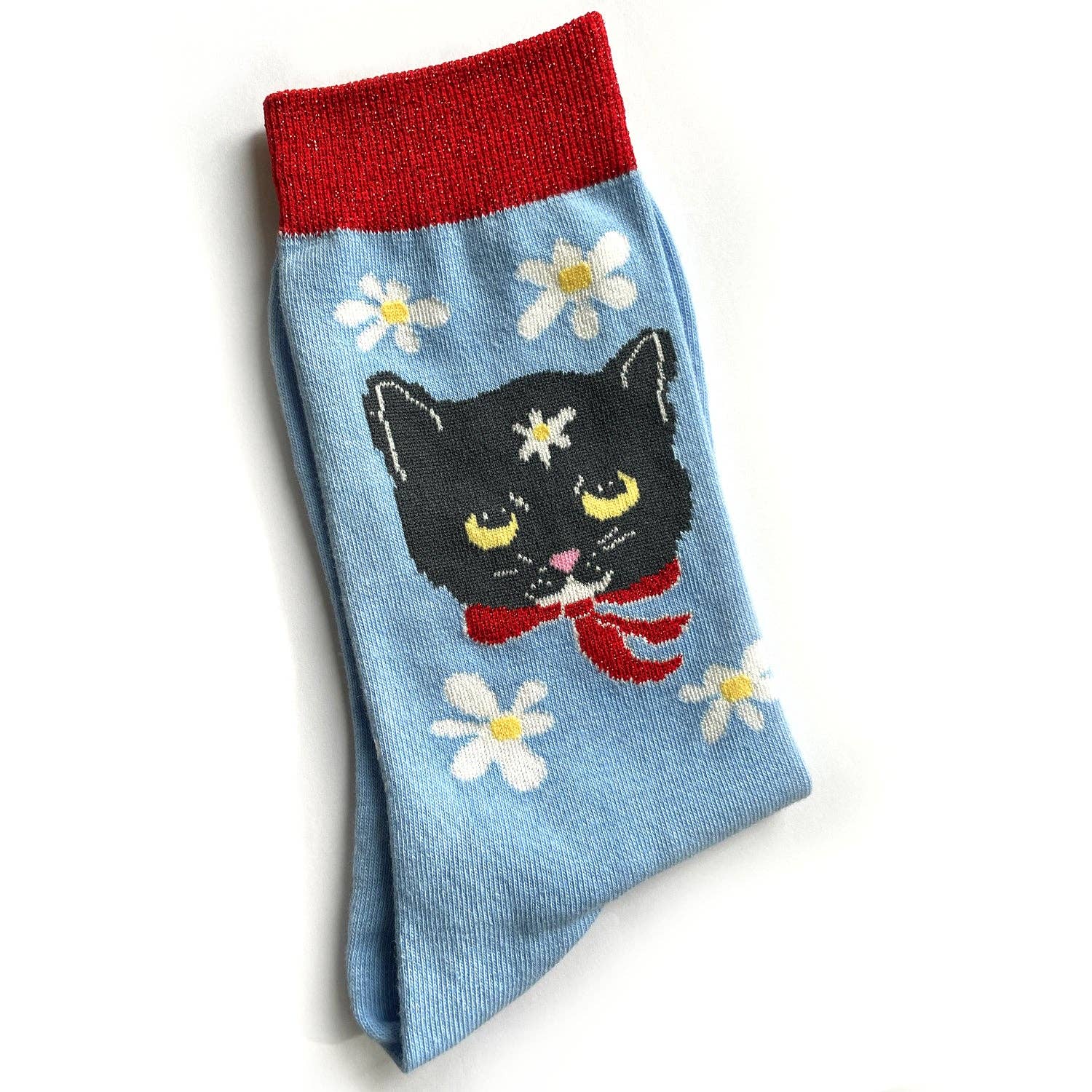 Sock with a black cat design, red band, and white flowers on a light blue background