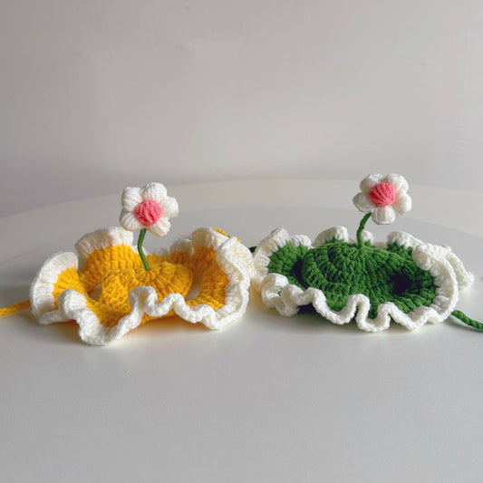 Two crocheted items resembling flowers and leaves on a white background
