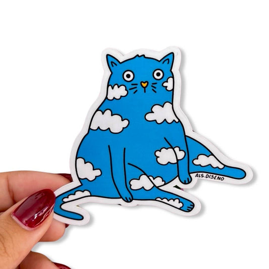 Blue cat sticker with clouds held by a hand on a white background