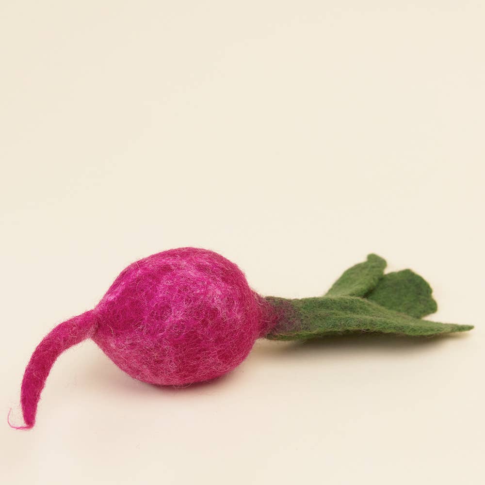 Felted pink flower with green stem on a beige background